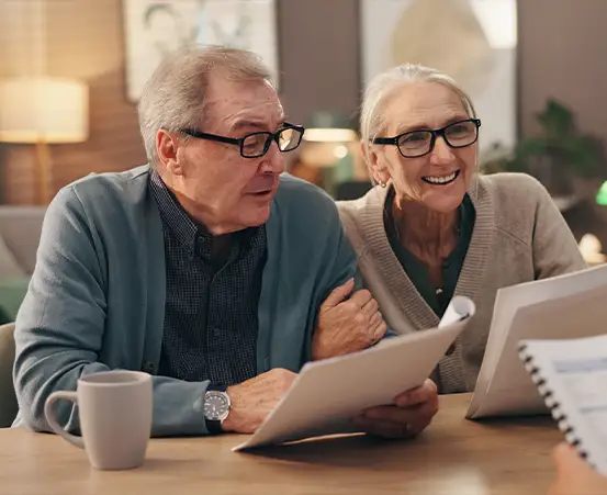 financial advisor meeting with clients to discuss wealth management