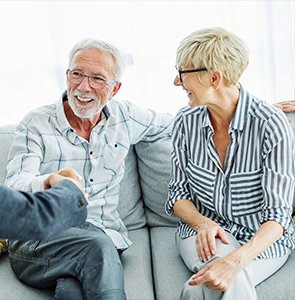 retired couple meeting with a financial advisor planning for retirement