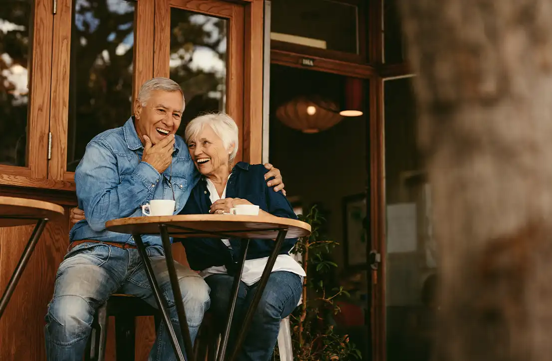 retirees at outdoor cafe planning for retirement